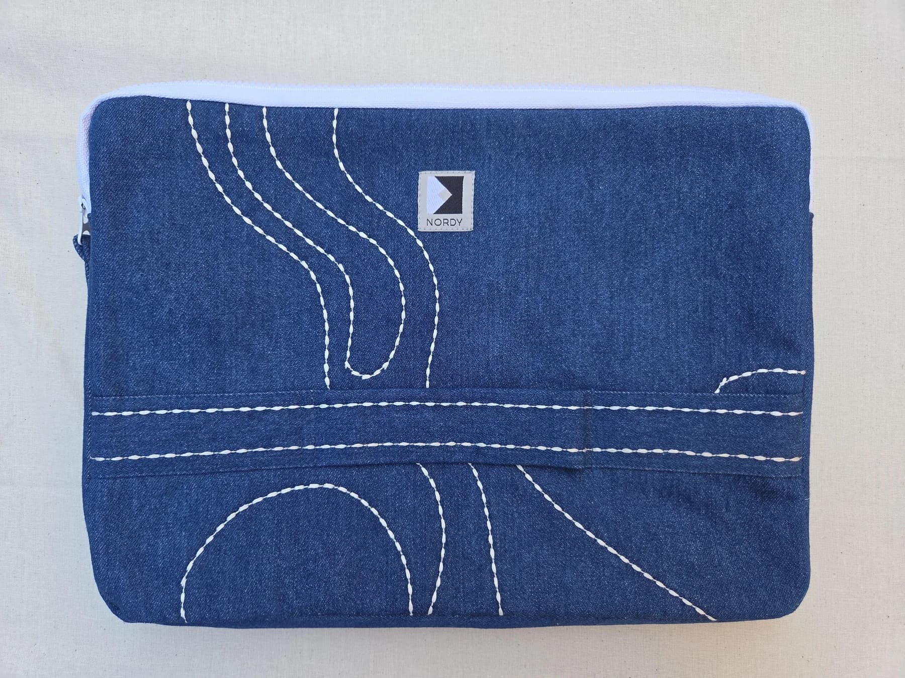 Embroidered denim laptop sleeve – front view